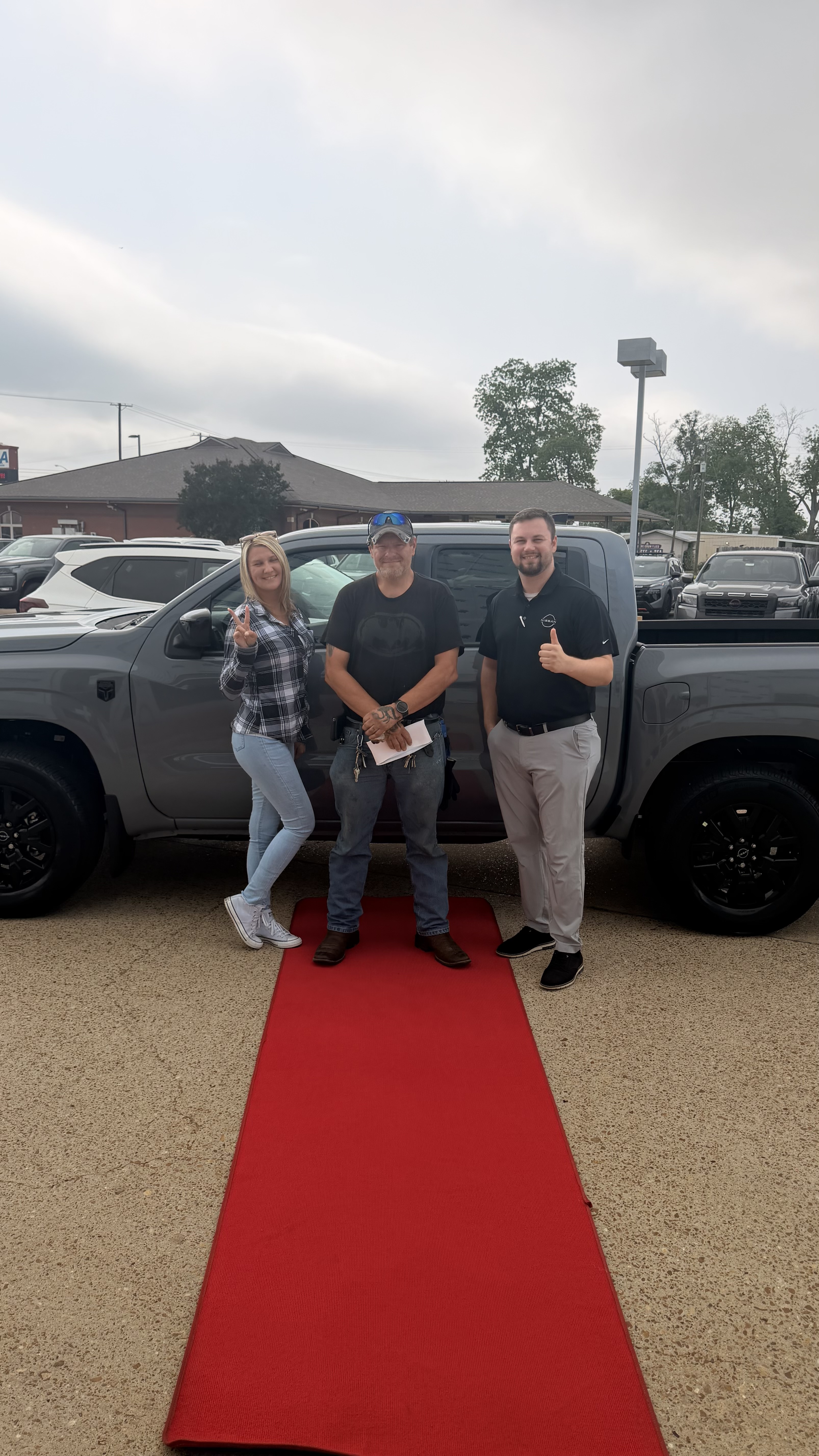 Happy customer with new vehicle