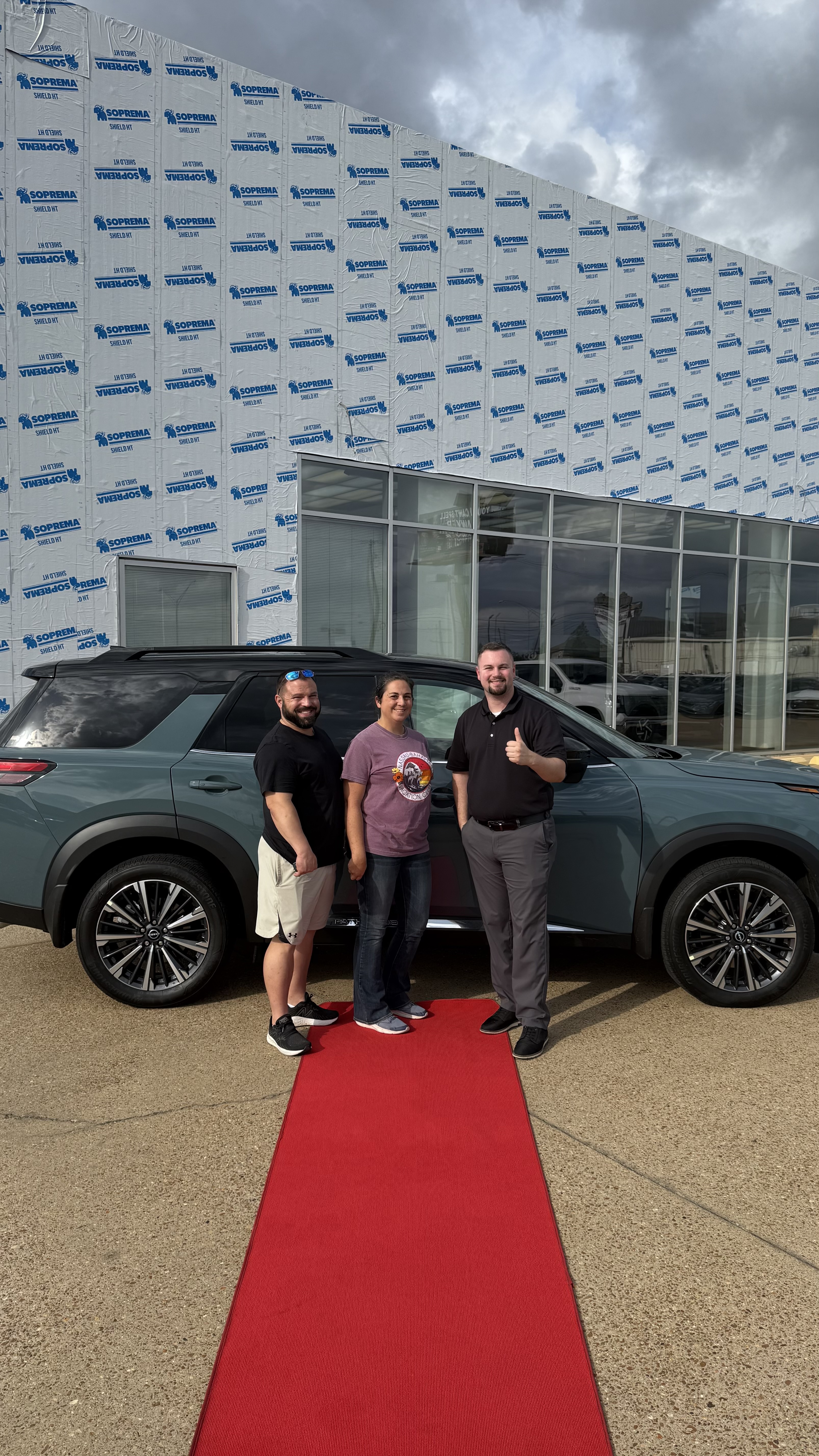 Happy customer with new vehicle