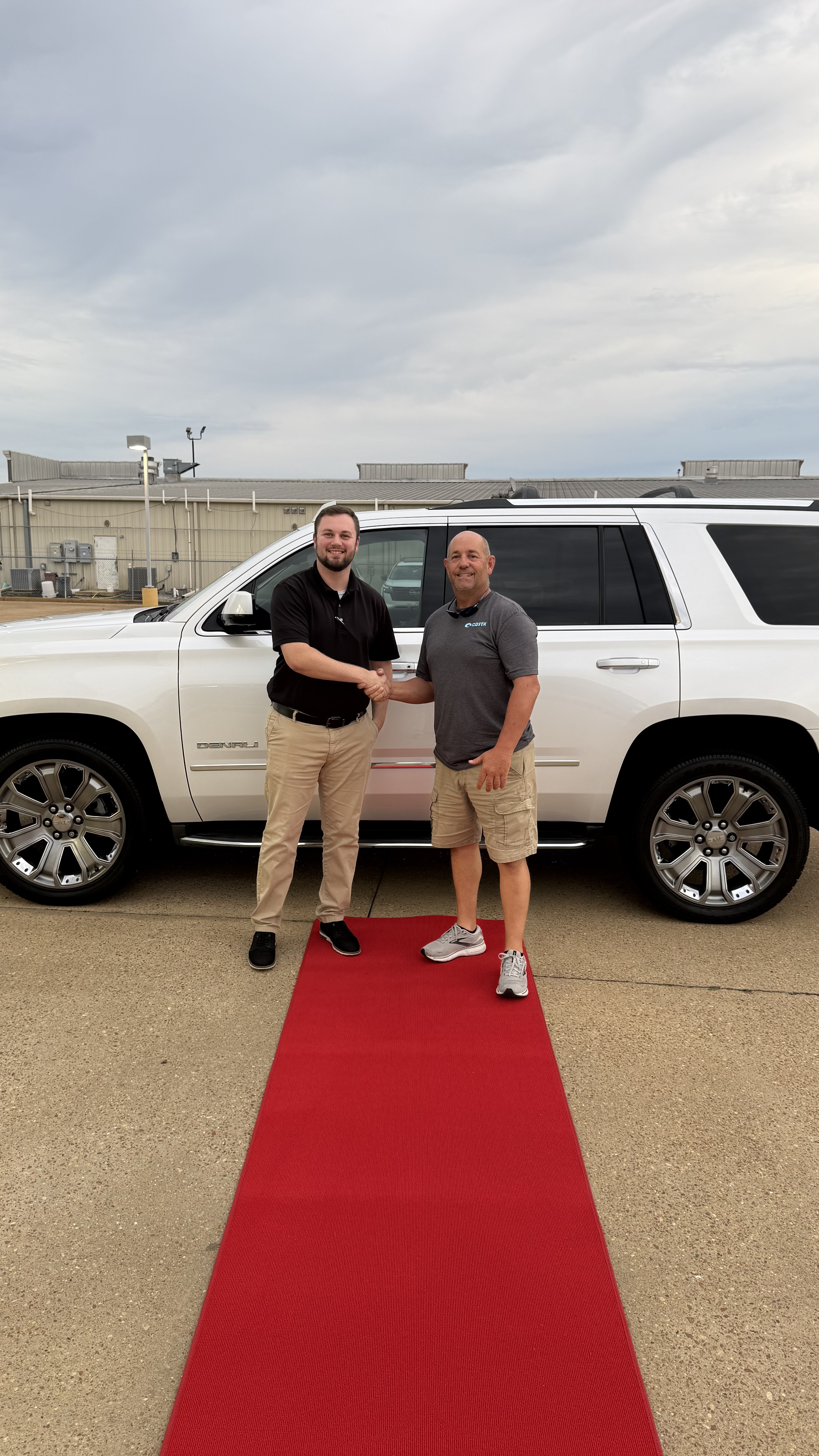 Happy customer with new vehicle