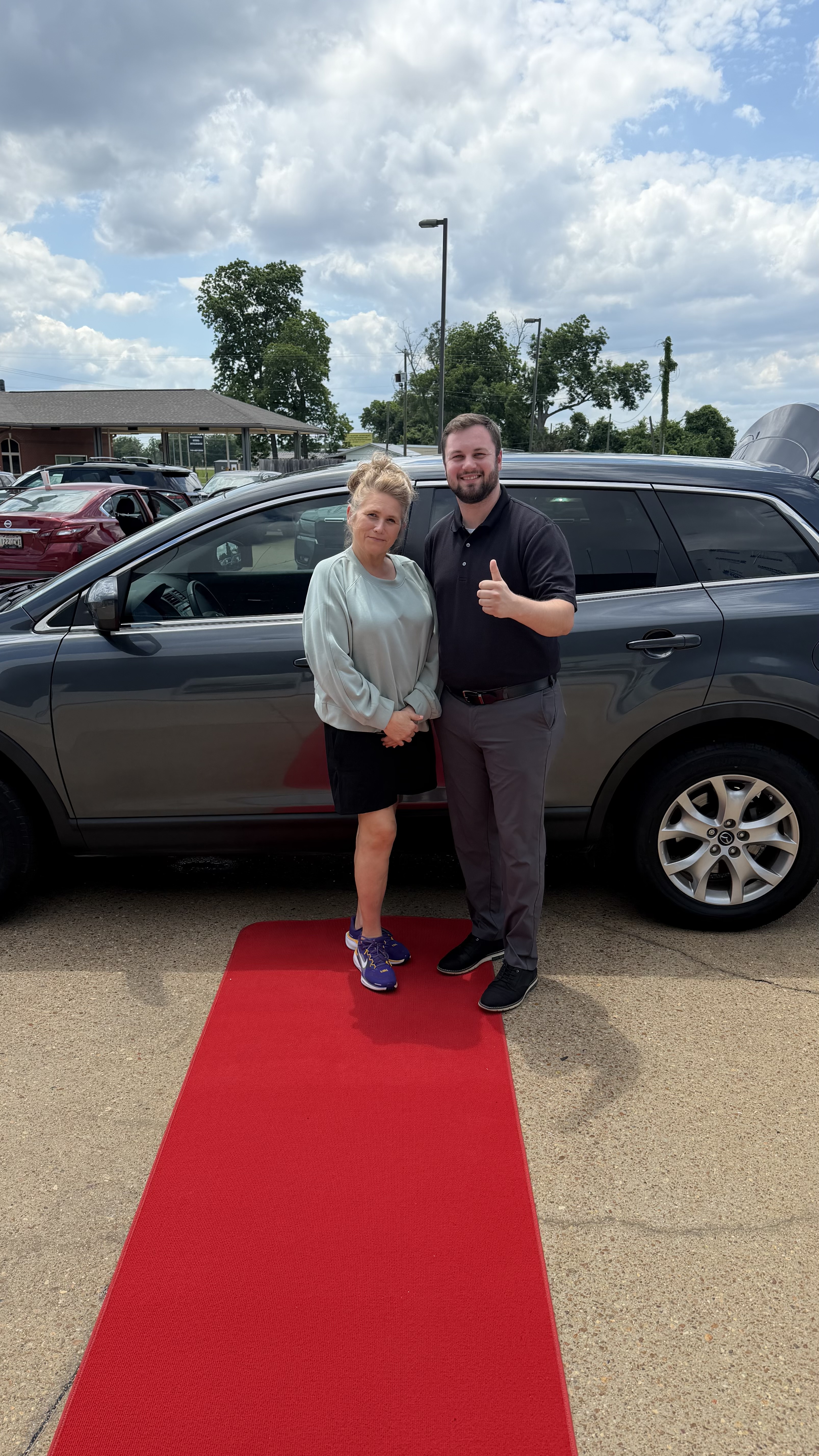 Happy customer with new vehicle