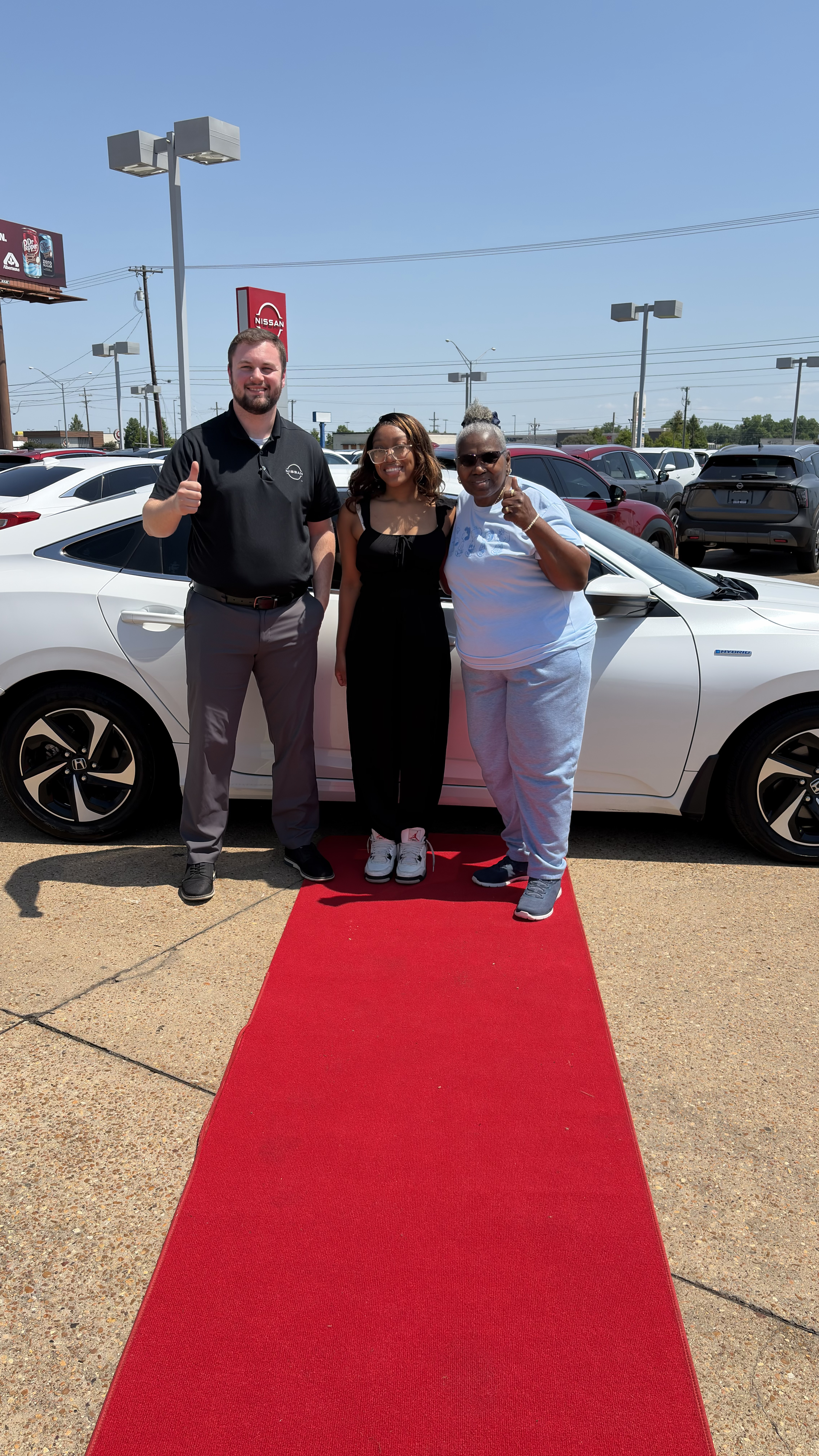 Happy customer with new vehicle