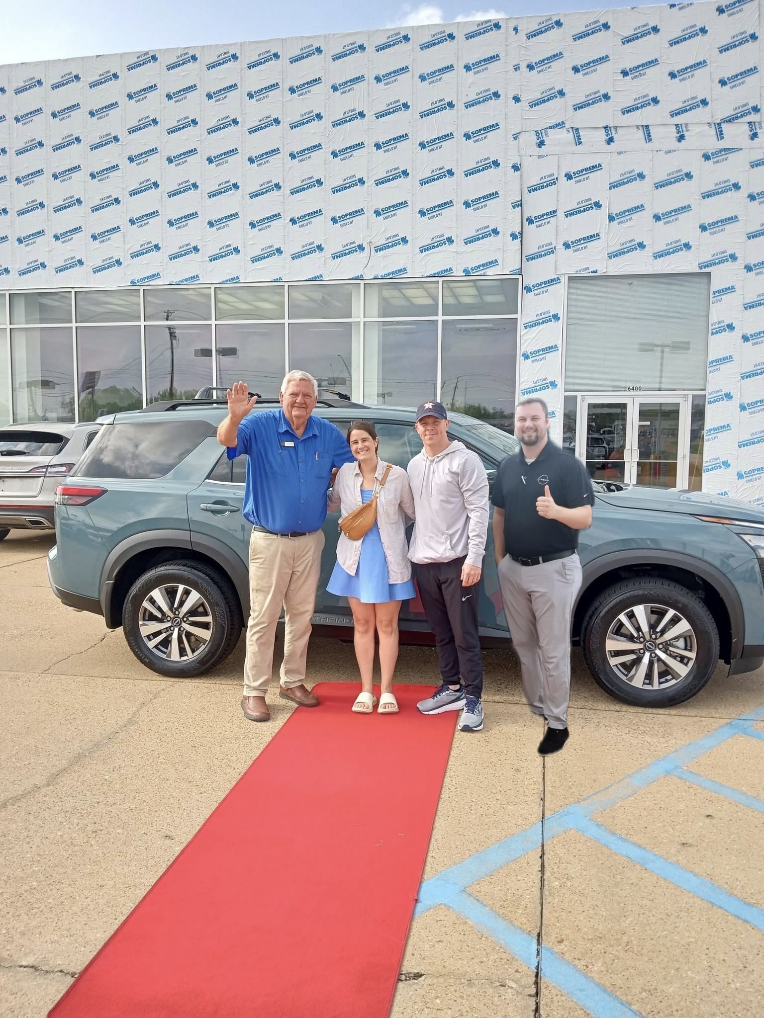 Happy customer with new vehicle