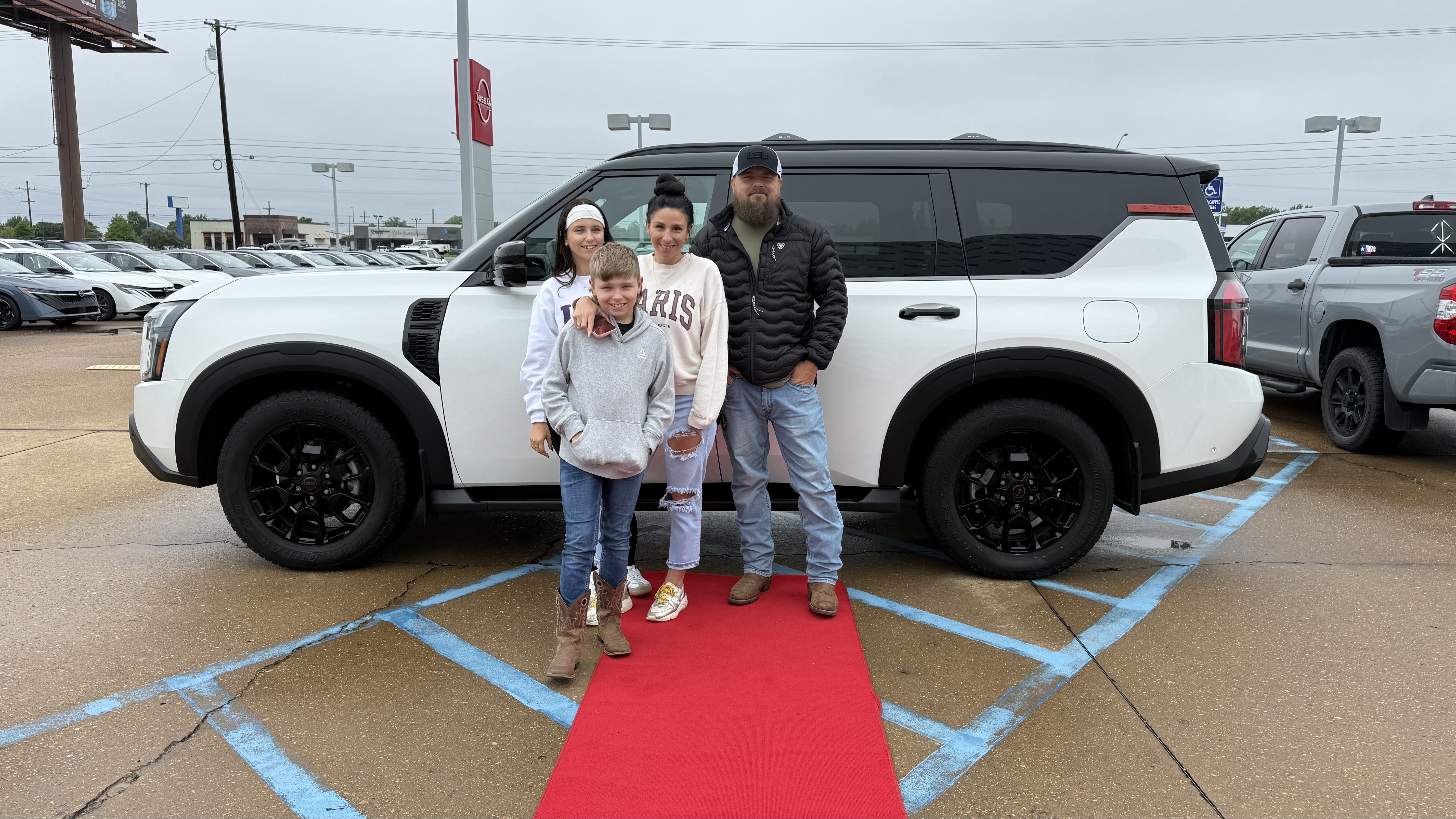 Happy customer with new vehicle