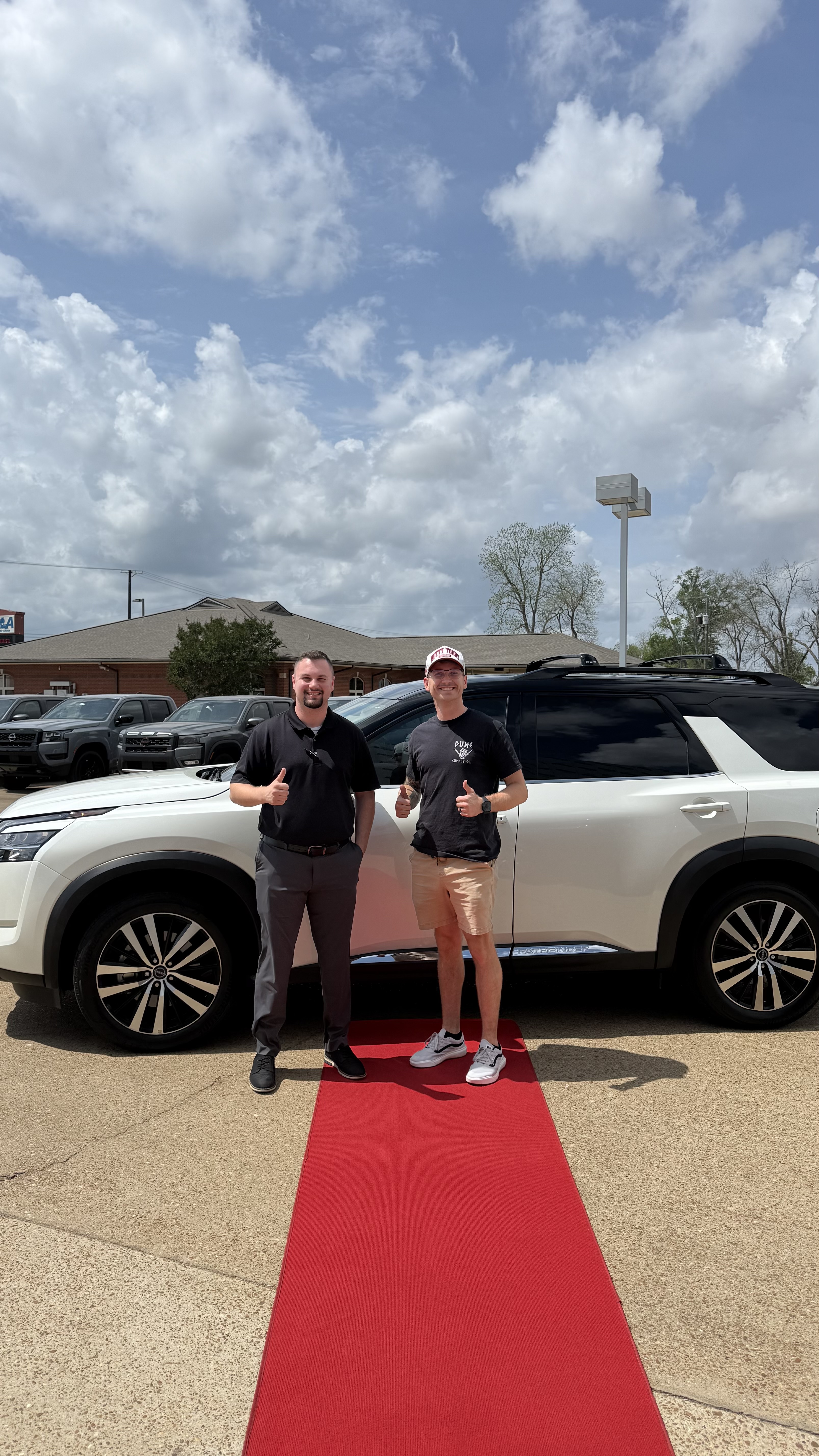 Happy customer with new vehicle