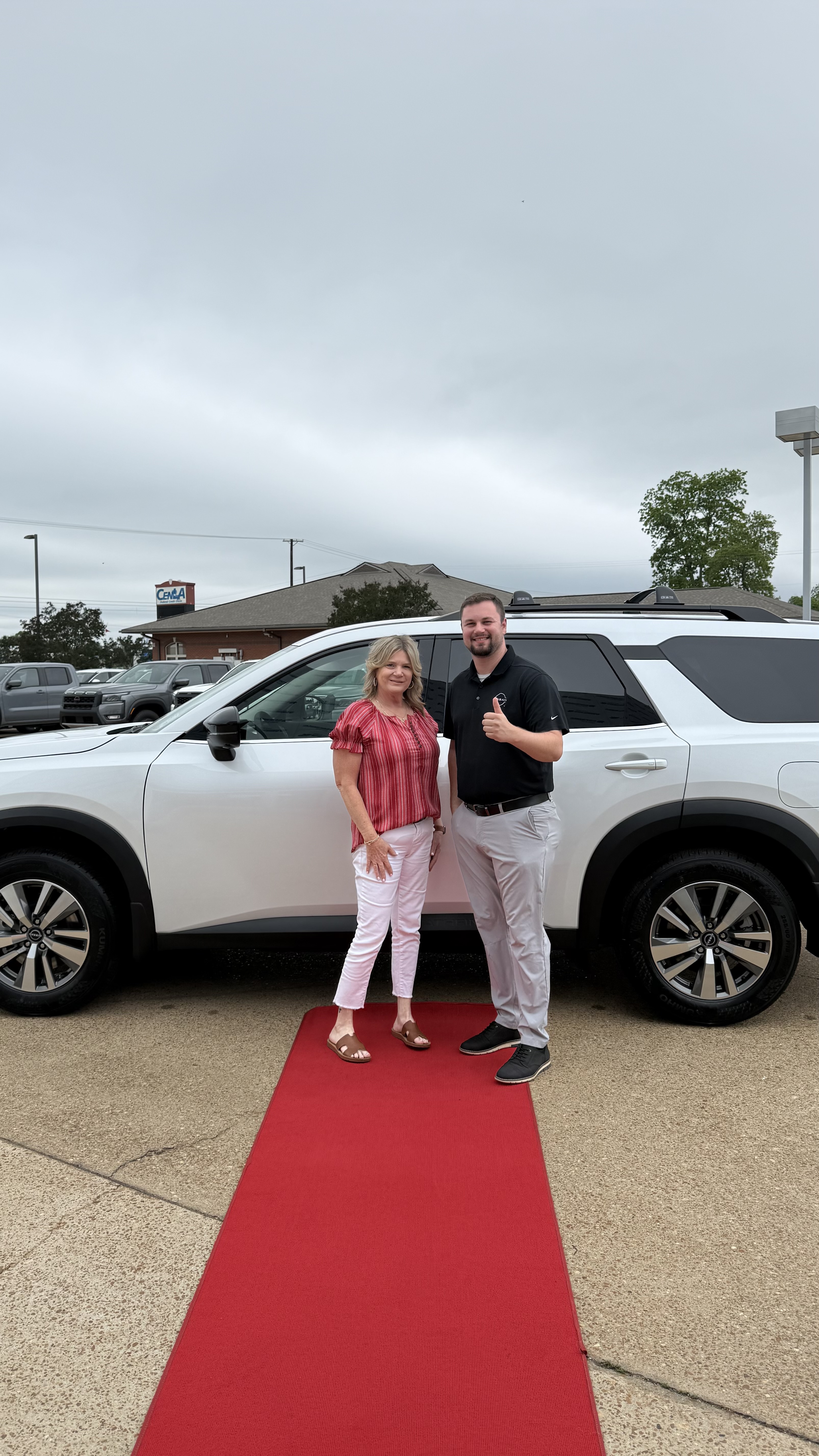 Happy customer with new vehicle