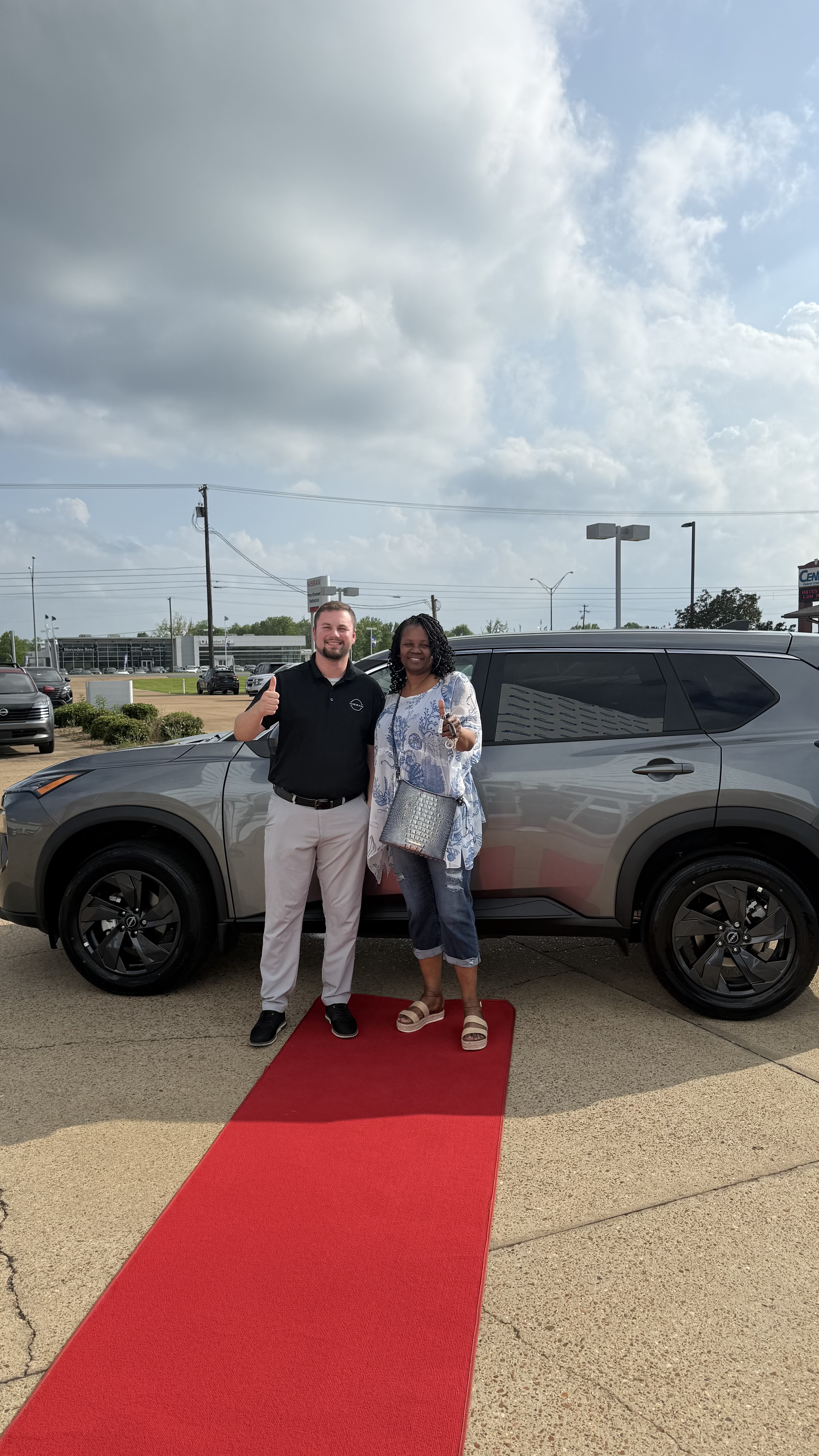 Happy customer with new vehicle